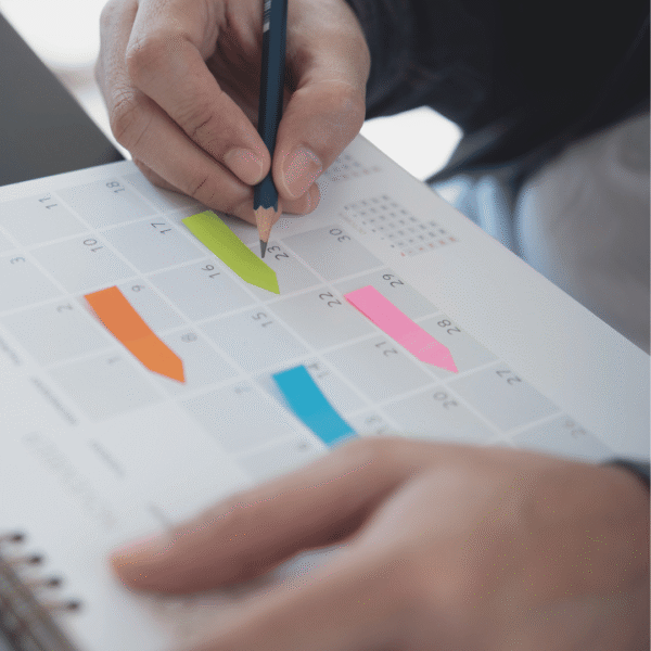 someone writing in calendar