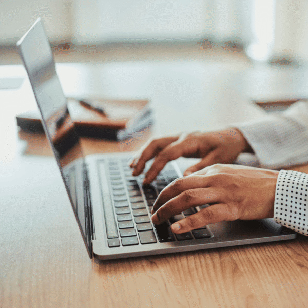 person typing on laptop